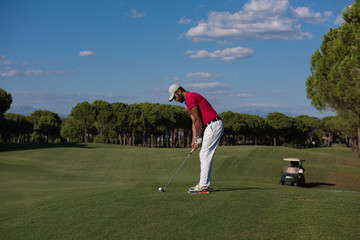 golf player hitting long shot