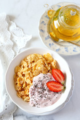 Corn flakes, yogurt, strawberries and chia seeds
