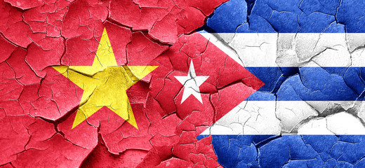 Vietnam flag with cuba flag on a grunge cracked wall