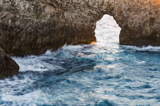 Natural arch over sea