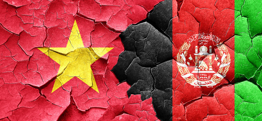 Vietnam flag with afghanistan flag on a grunge cracked wall