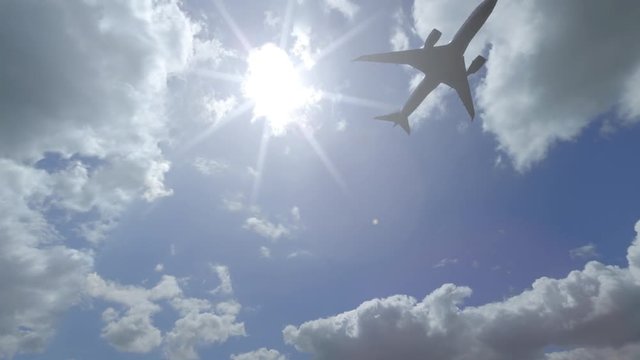 Distant Boing 787 flying across beautiful cloudy sky. 4K sunny weather pan video