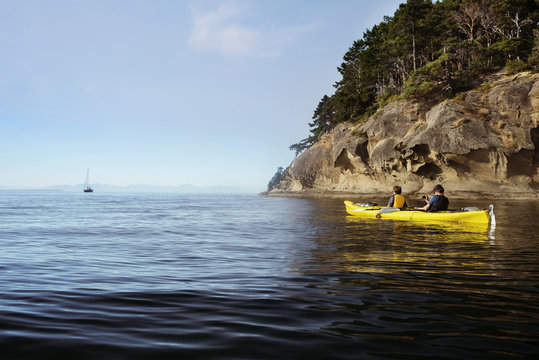 Men rowing a boat in sea