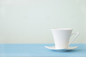 Stock Photo:.cup of coffee on the wooden table