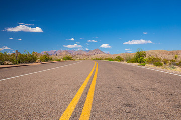Beautiful cinematic view of the road under the blue cloudless sky in America