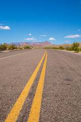 Beautiful cinematic view of the road under the blue cloudless sky in America