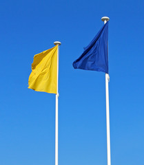 yellow flag and blue flag