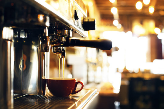 Coffee Pouring From Machine In Cafe