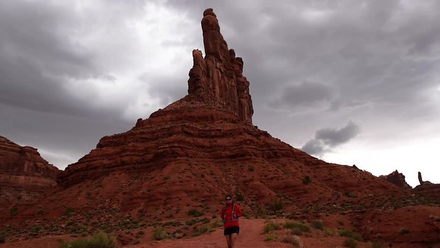 Woman Hiker Backpacker walking through the Valley of the Gods