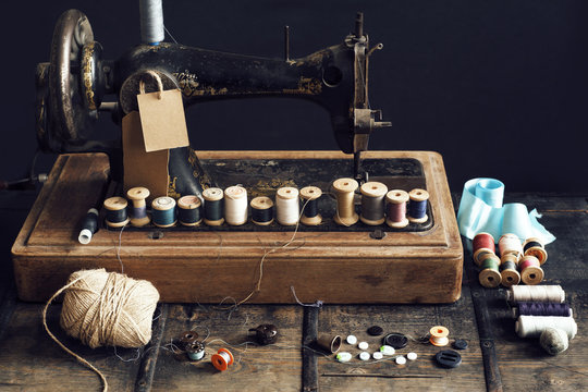 Vintage sewing machine with colorful thread spools