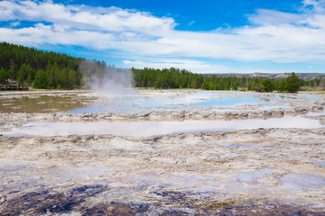 Beautiful cinematic view of nature landscape in the American West under the blue cloudy sky. Geyser.
