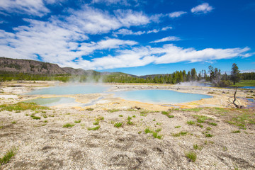 Beautiful cinematic view of nature landscape in the American West under the blue cloudy sky. Geyser.