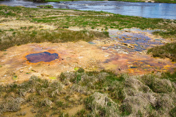 Beautiful cinematic view of nature landscape in the American West under the blue cloudy sky. Geyser.