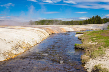 Beautiful cinematic view of nature landscape in the American West under the blue cloudy sky. Geyser.