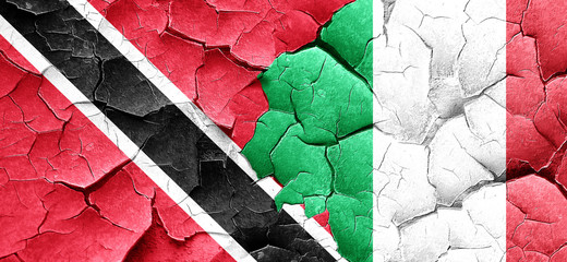 Trinidad and tobago flag with Italy flag on a grunge cracked wal