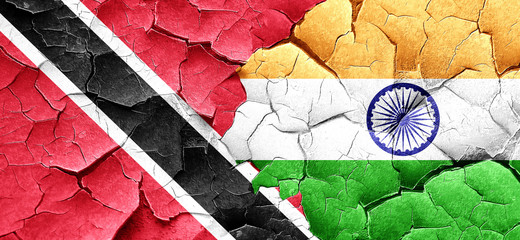 Trinidad and tobago flag with India flag on a grunge cracked wal