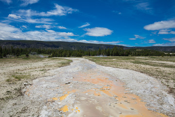 Beautiful cinematic view of nature landscape in the American West under the blue cloudy sky. Geyser.