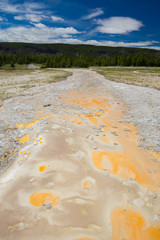 Beautiful cinematic view of nature landscape in the American West under the blue cloudy sky. Geyser.