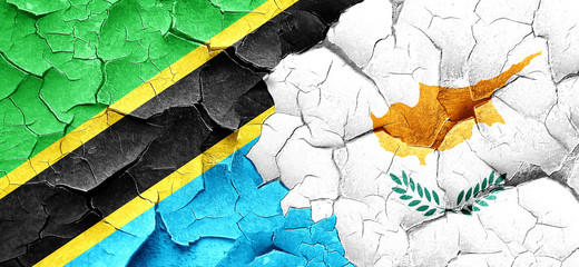 Tanzanian flag with Cyprus flag on a grunge cracked wall