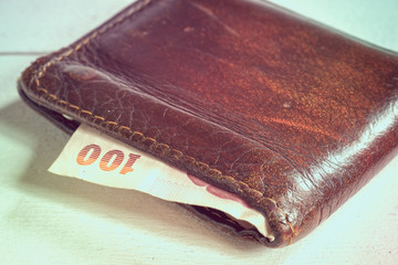 save money for investment concept money in leather wallet with filter effect retro vintage style