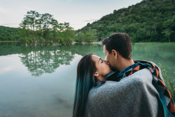 Couple resting on lake