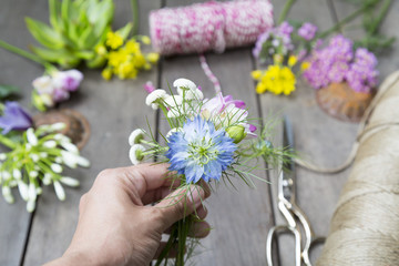 still life of arranging flowers on wooden background at flower s