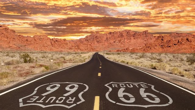 Route 66 Mojave desert highway sign with romanticized sunrise time lapse.
