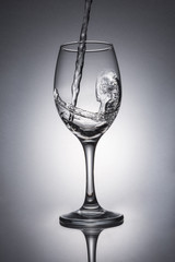Water pouring into wine glass