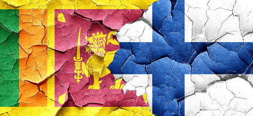 Sri lanka flag with Finland flag on a grunge cracked wall