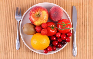 Fresh fruits and vegetables on plate, healthy nutrition