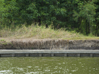 Concrete riverbank to protect the soil from erosion.
