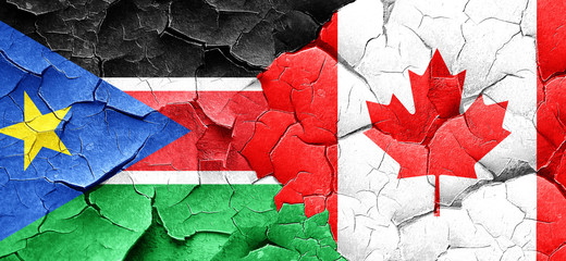 south sudan flag with Canada flag on a grunge cracked wall