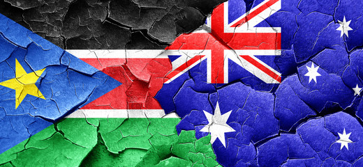 south sudan flag with Australia flag on a grunge cracked wall