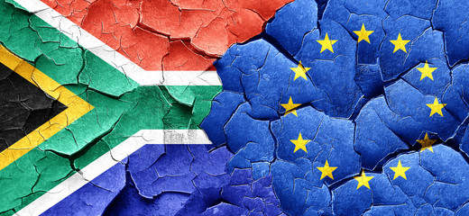 South africa flag with european union flag on a grunge cracked w