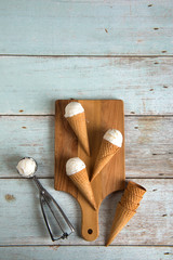 Fototapeta na wymiar creamy vanilla ice cream in preparation with rustic background a