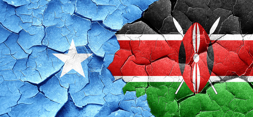 Somalia flag with Kenya flag on a grunge cracked wall