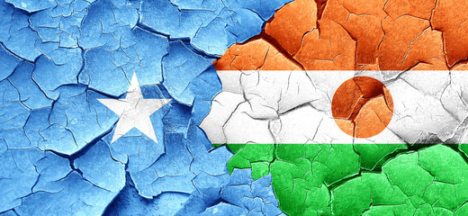 Somalia flag with Niger flag on a grunge cracked wall