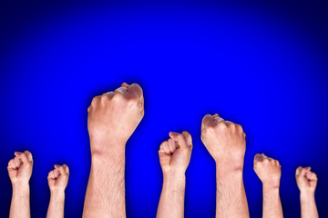 group of human hand showing fist on blue background, fighting fist concept, fist sign or symbol.