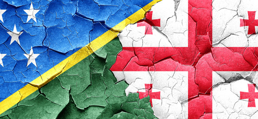 Solomon islands flag with Georgia flag on a grunge cracked wall