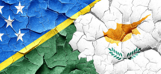 Solomon islands flag with Cyprus flag on a grunge cracked wall