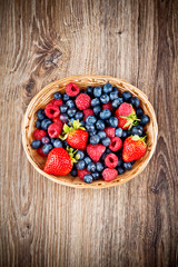Berries on wooden background