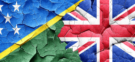 Solomon islands flag with Great Britain flag on a grunge cracked