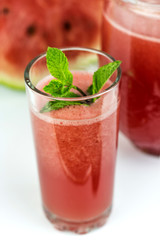 Close-up of fresh watermelon juice isolated on white background