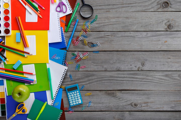 School supplies on wooden table with copy space