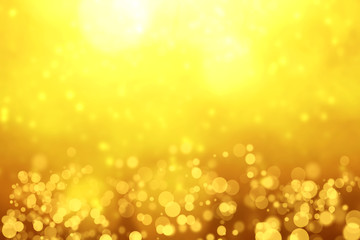 Blurred Golden Bokeh Background with sparkles and glitter.Golden