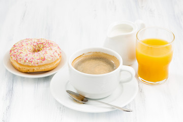 cup of coffee, glazed donuts and orange juice