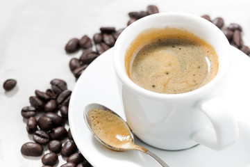 cup of espresso and coffee beans