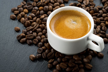 espresso on coffee beans background