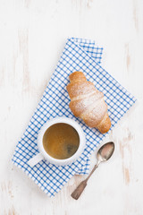 espresso and fresh croissant, top view