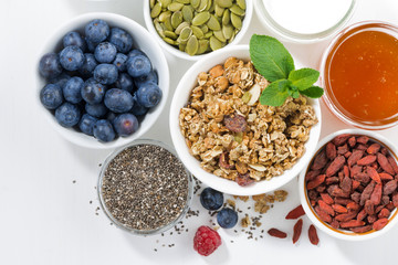 foods for healthy nutrition and fresh berries on white table